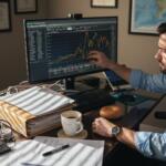 Trader adjusting settings on MT4 MT5 workstation