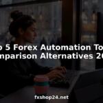 Trader working on forex automation software at desk